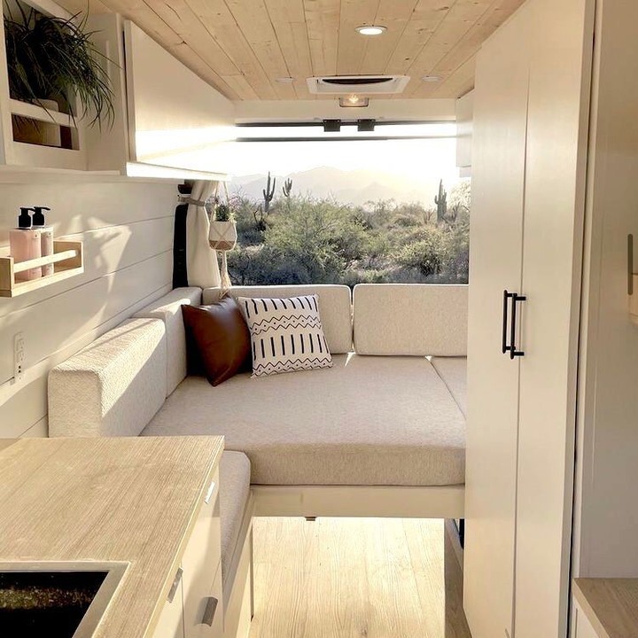 Minimalist Camper Bed Framed by Desert Scenery