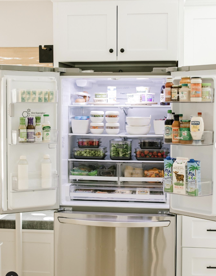White Cabinets Above the Refrigerator With Black Hardware
