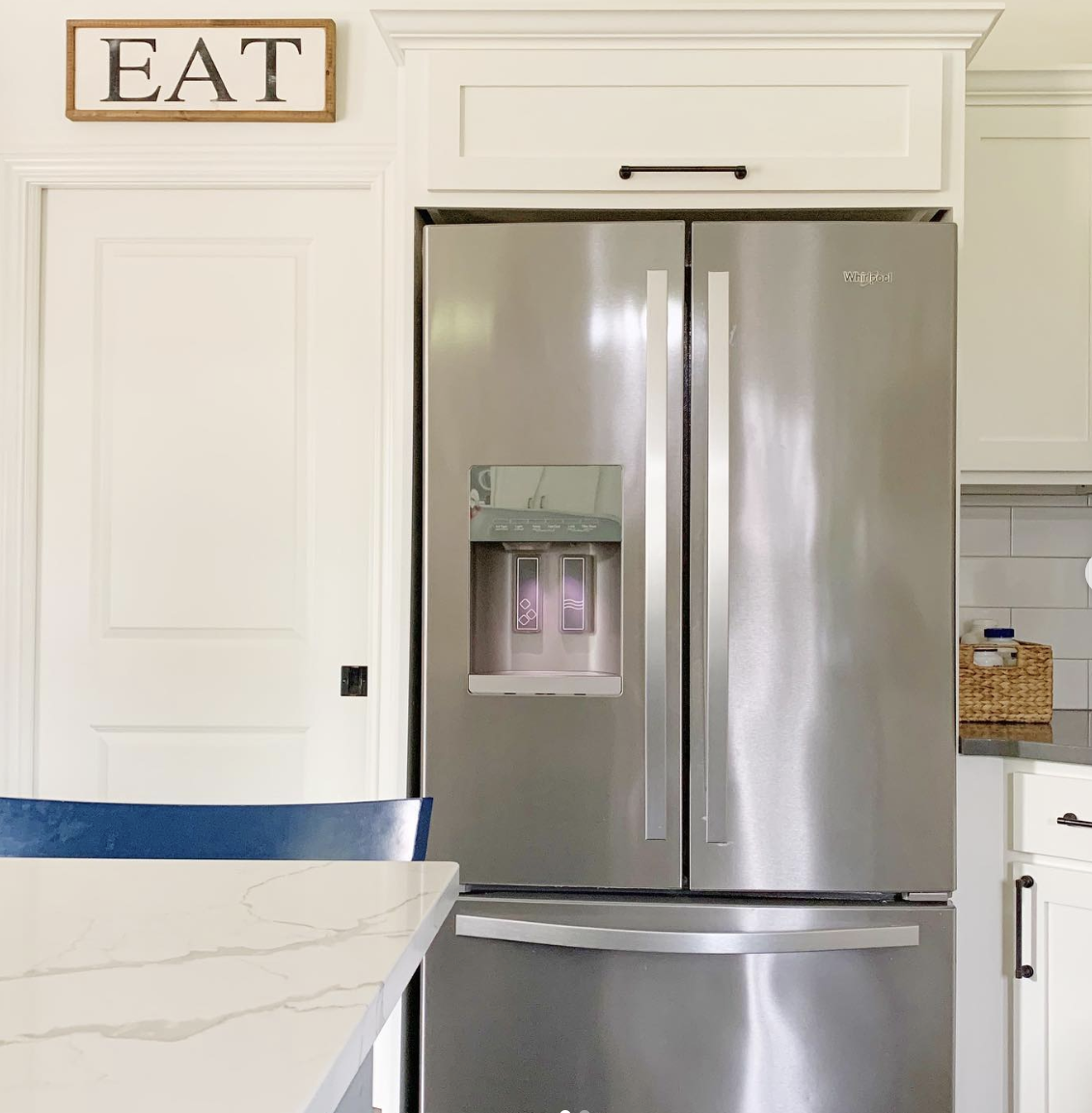 Above-Refrigerator Storage in a Farmhouse Kitchen