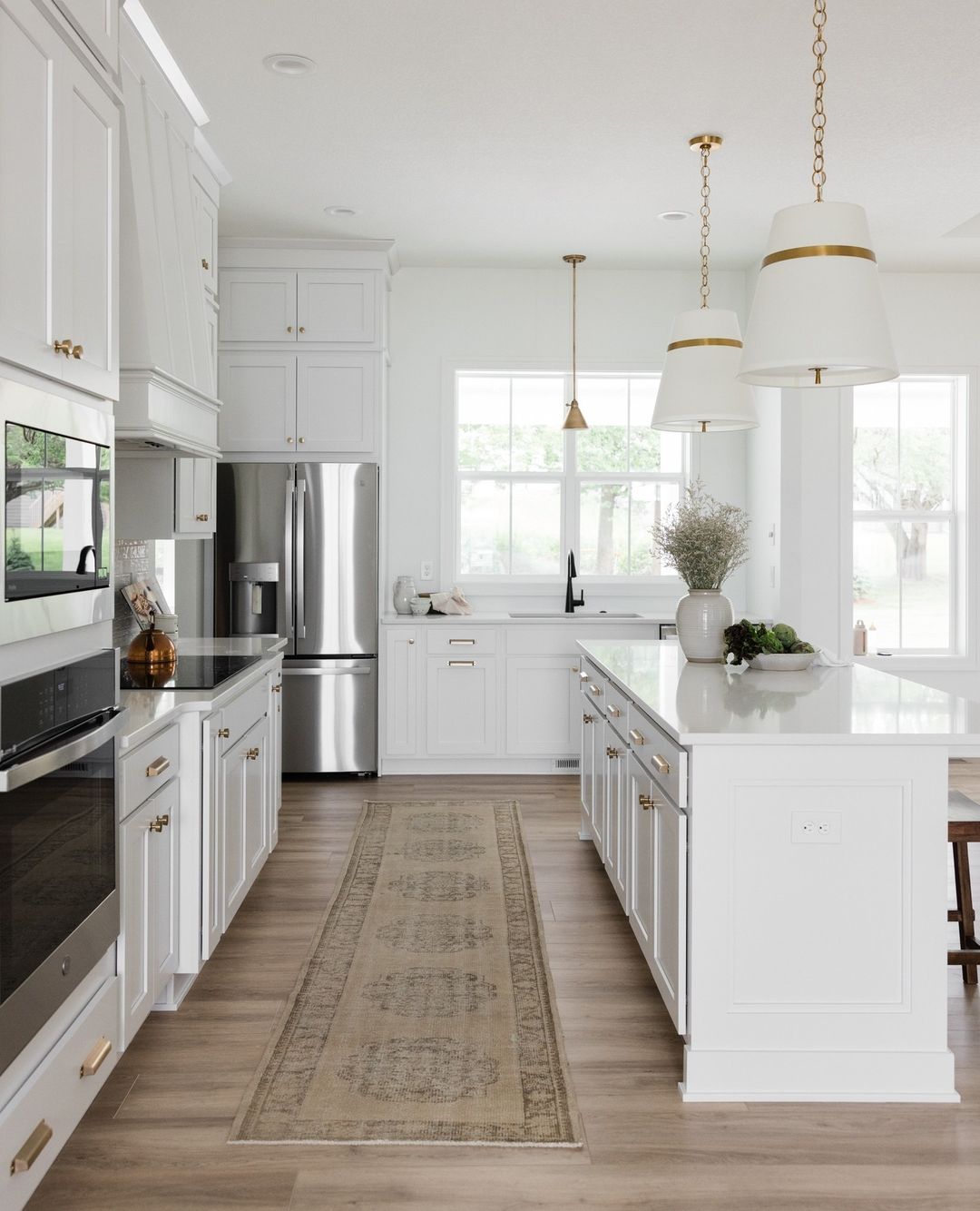Gold-Accented Kitchen Storage Over the Refrigerator