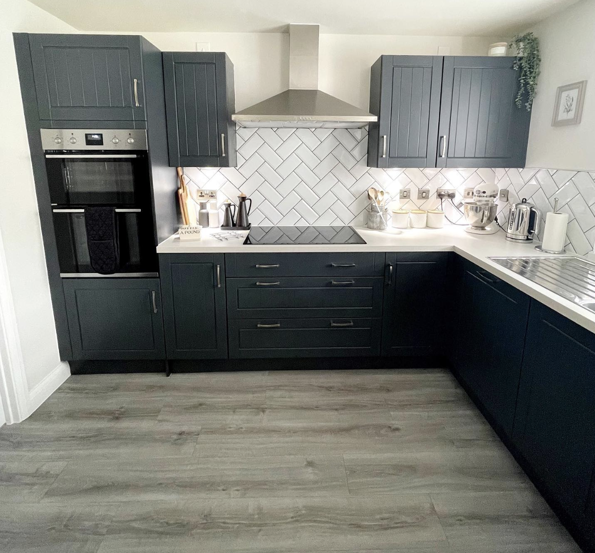 L-Shaped Kitchen with Herringbone Wall Tile