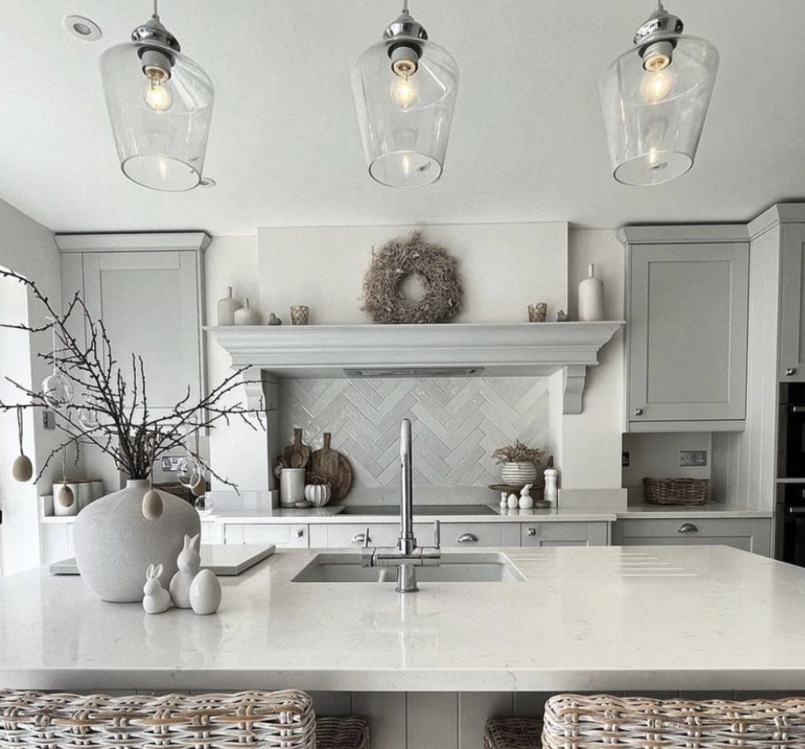 Grey Kitchen With Wood Details and Glass Pendants