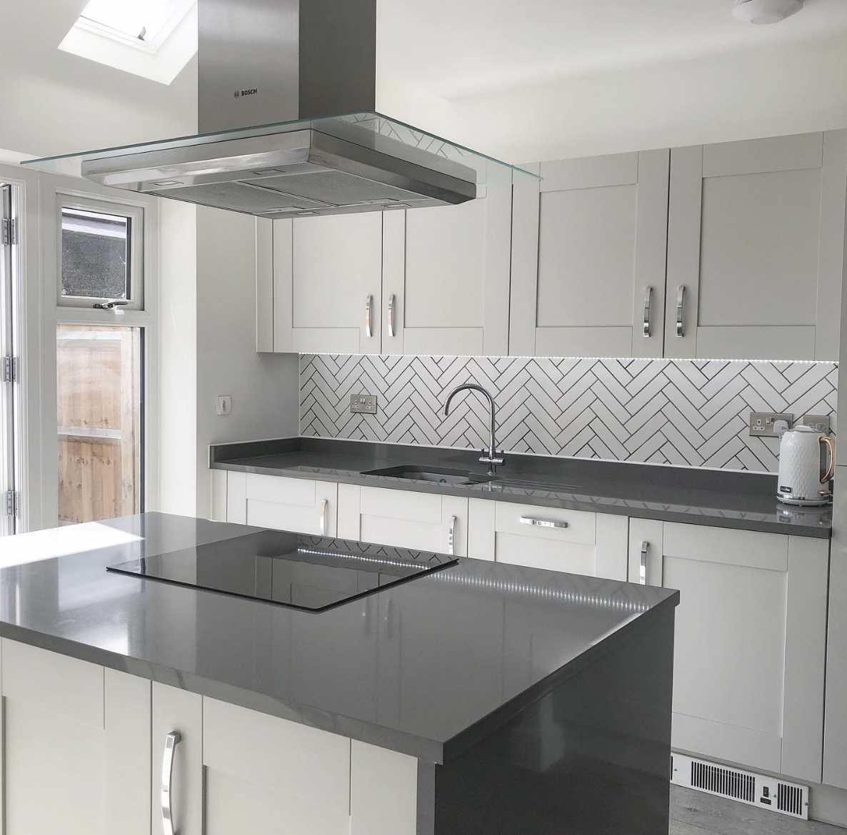 Grey Cabinet Kitchen With Black Countertops