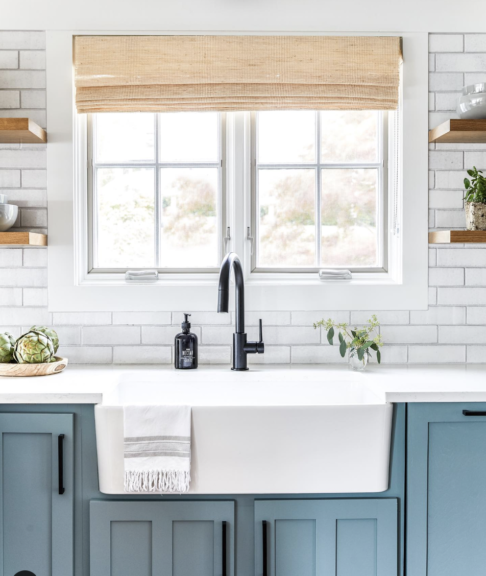 Blue Cabinets Paired With a White Faux Brick Backsplash