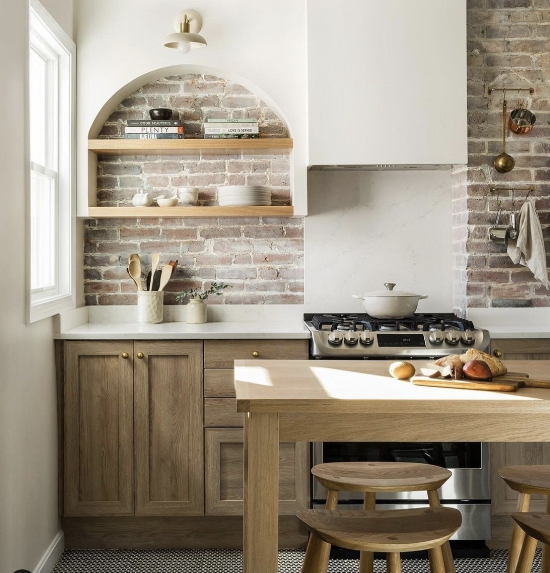 Arched Built-Ins Framing a Red Brick Backsplash