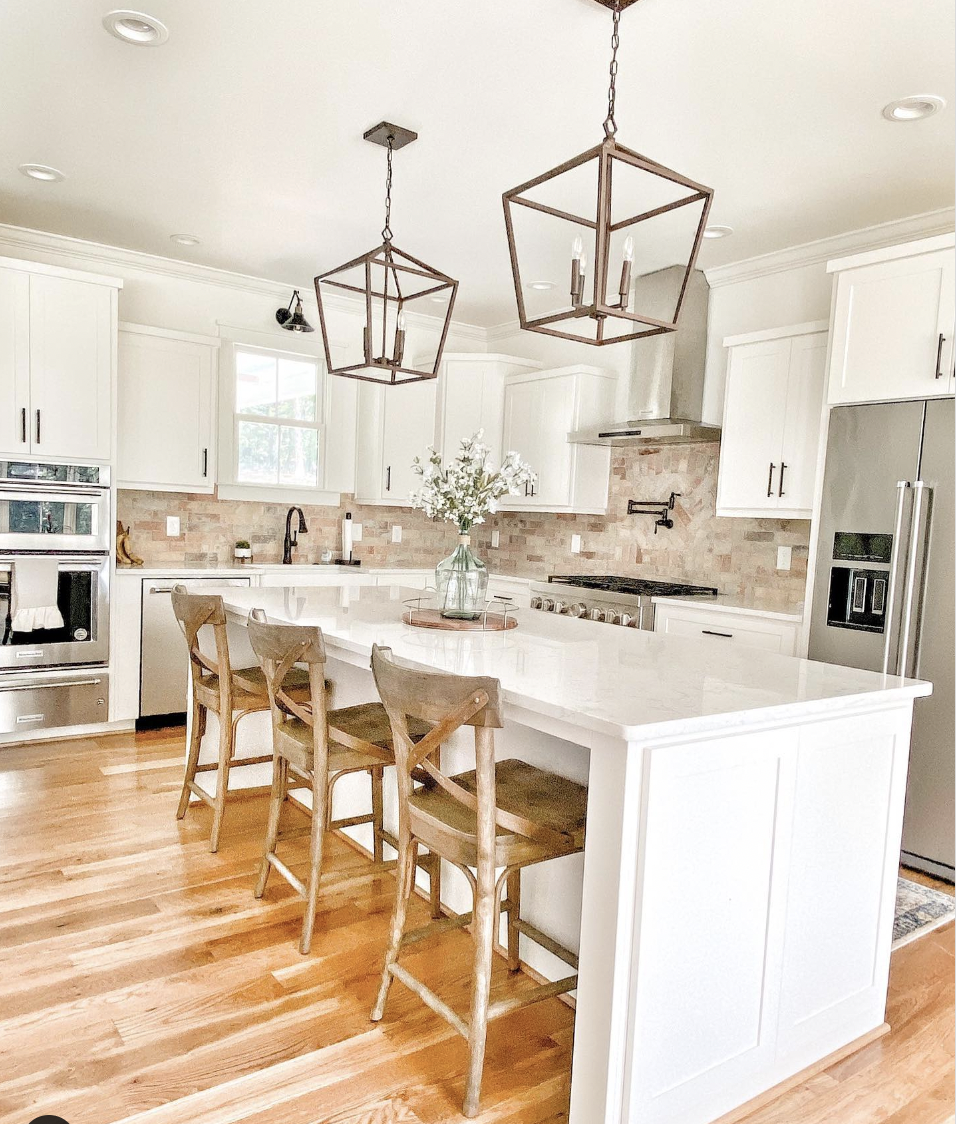 White Cabinets With a Beige and Brown Brick Tile Backsplash
