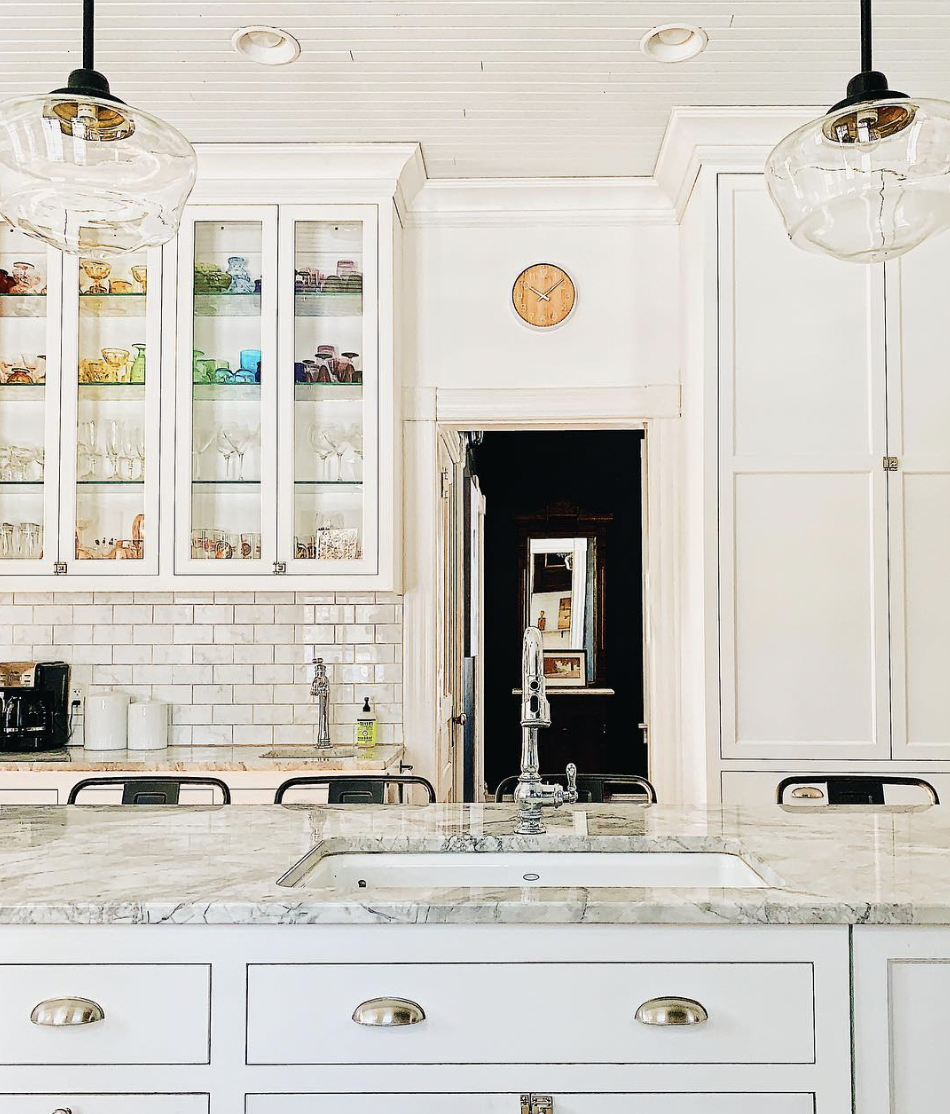 Glass-Front Cabinets Topped With Decorative Trim