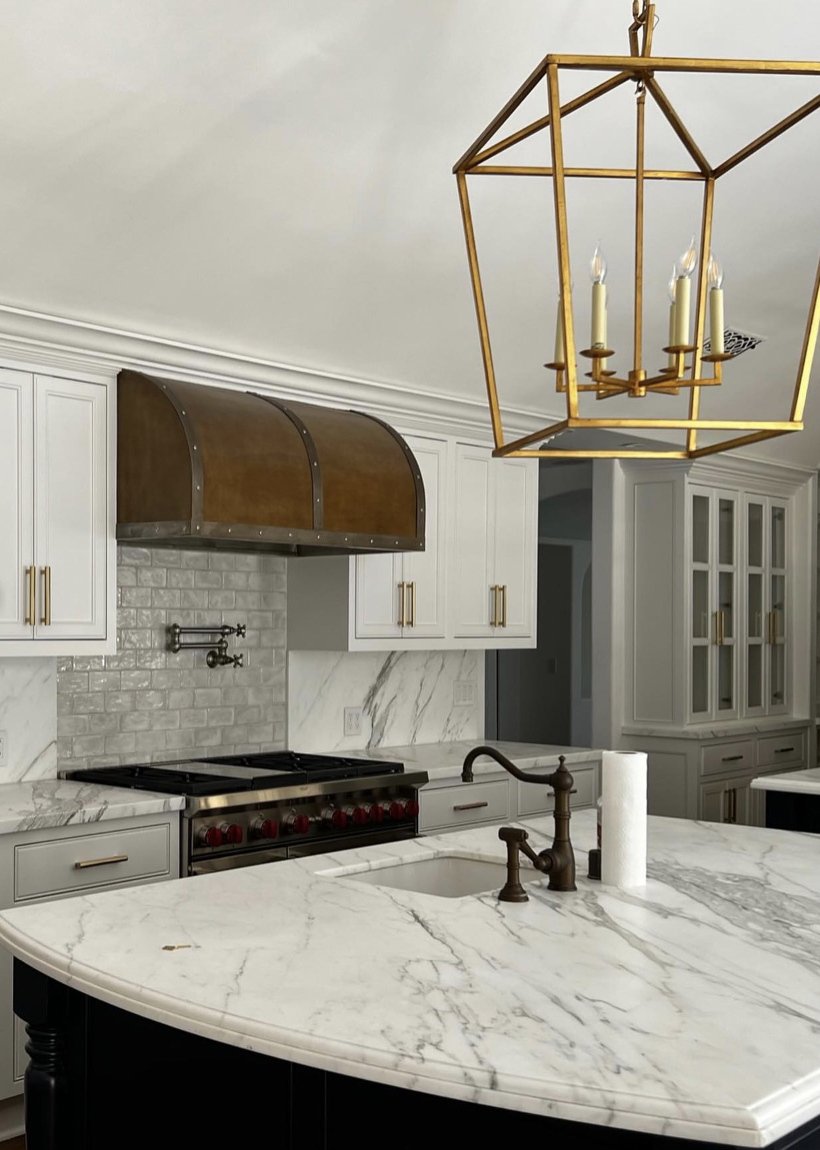 Gold Candle-Style Light Above the Sink