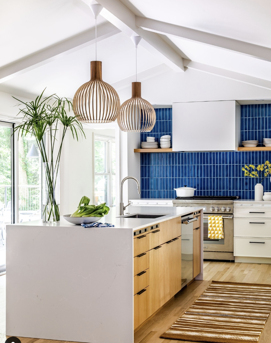 Brass Pendant Over a Sink with Blue Backsplash