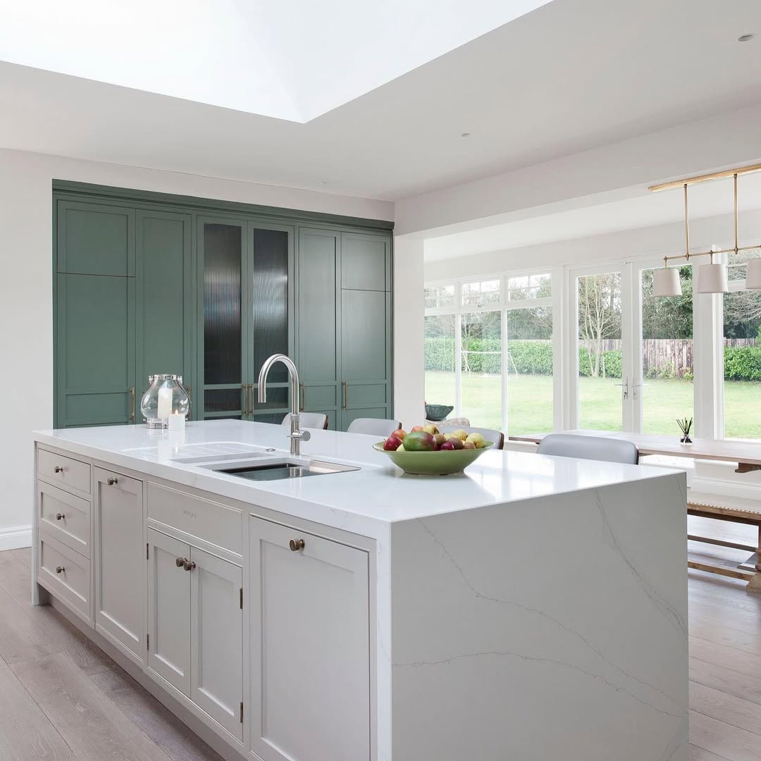 Built-In Green Cabinetry With a Frosted-Glass Pantry Door
