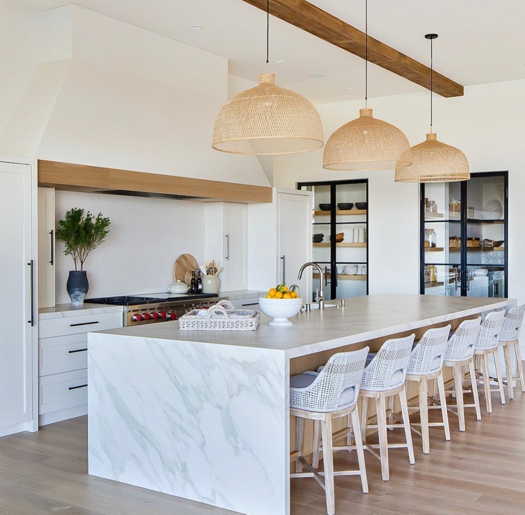 Black-Framed Glass Pantry Door in a White Kitchen