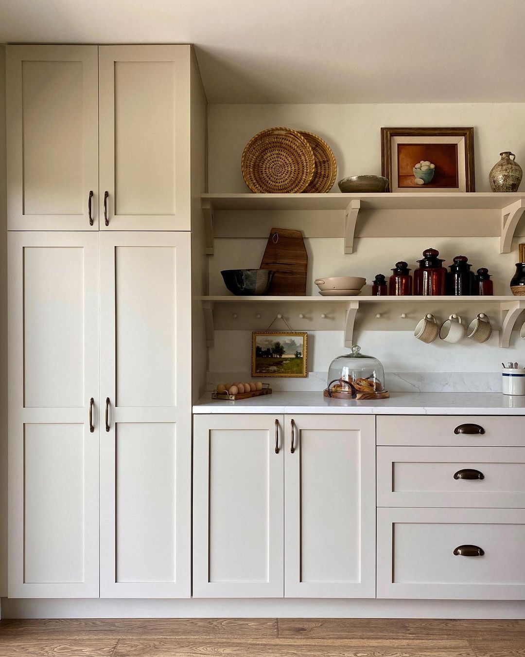 Beige Cabinets Above Open and Closed Shelves