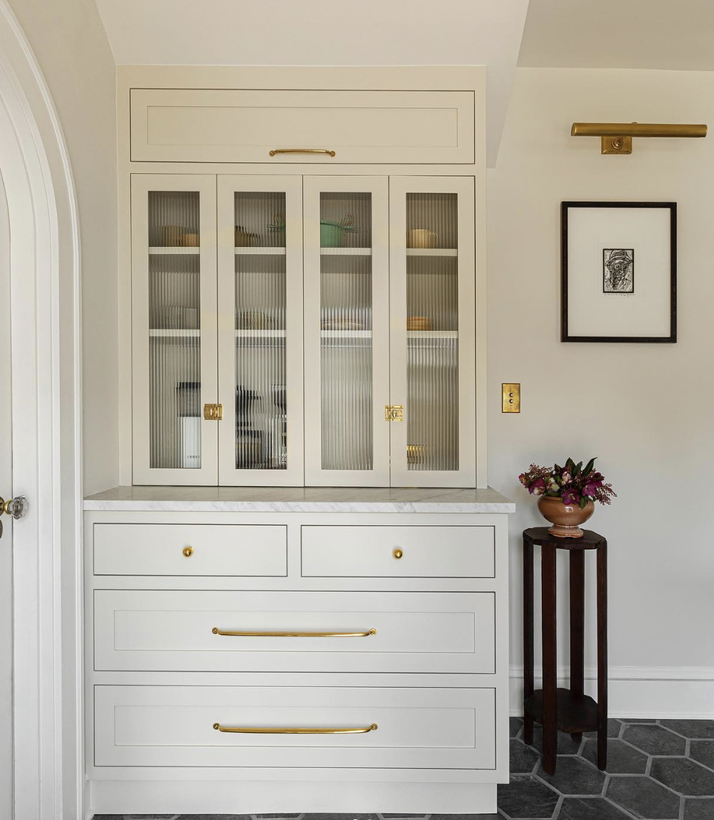 White Built-In Cabinetry and Marble Countertop